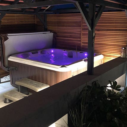 Custom designed hot-tub area Custom build area to house a hot-tub within the garden