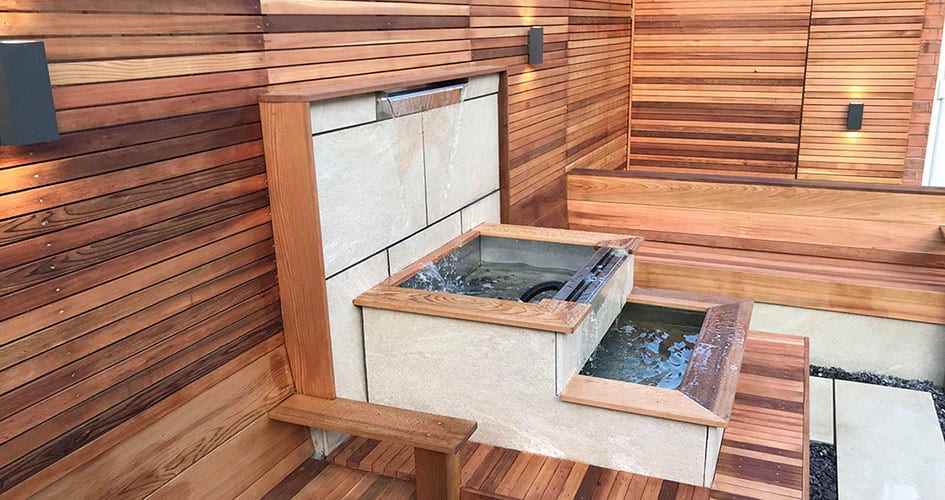 Three tiered water feature Three tier water feauter built into garden design
